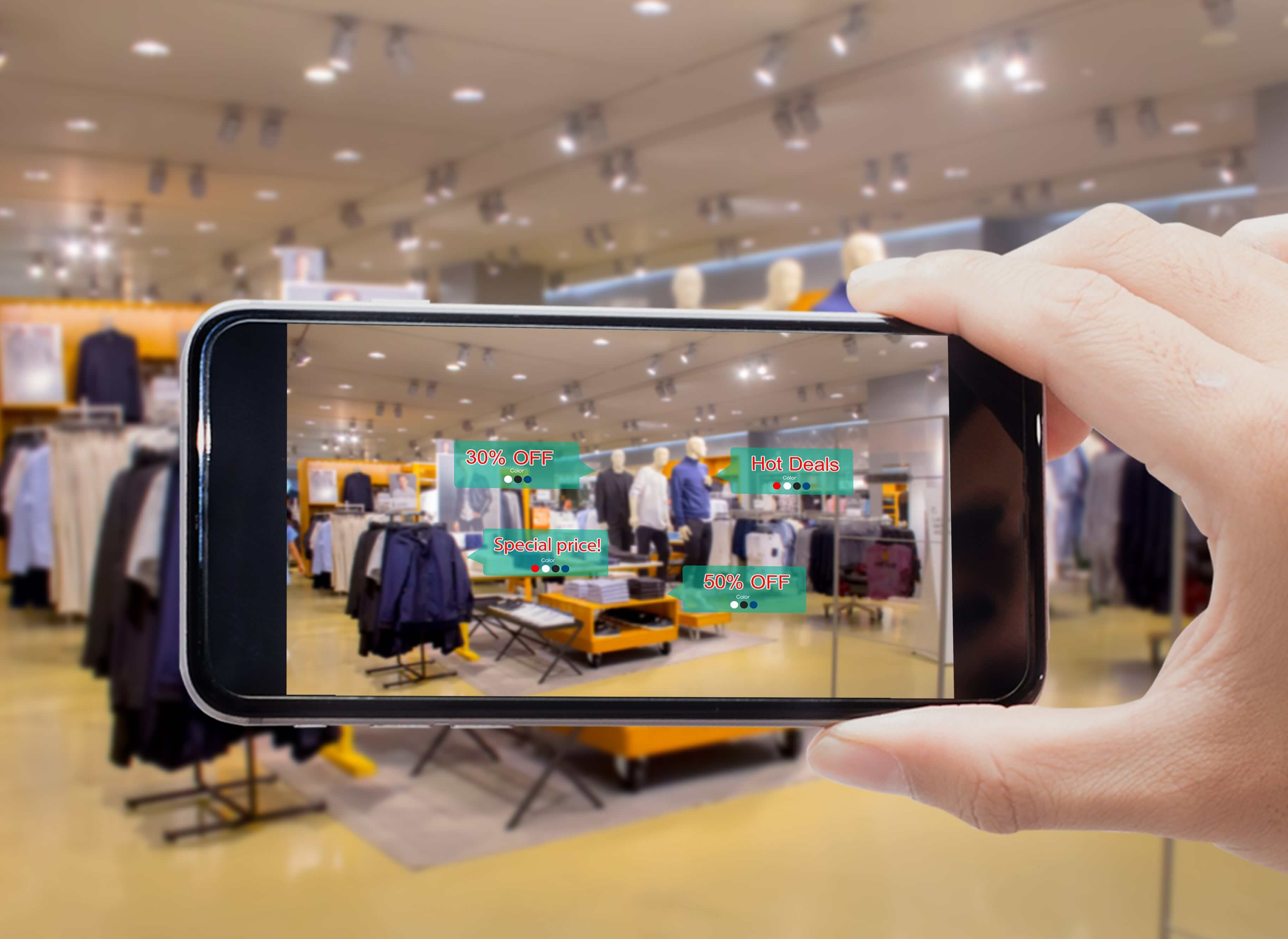 A hand showing phone AR technology in shopping products